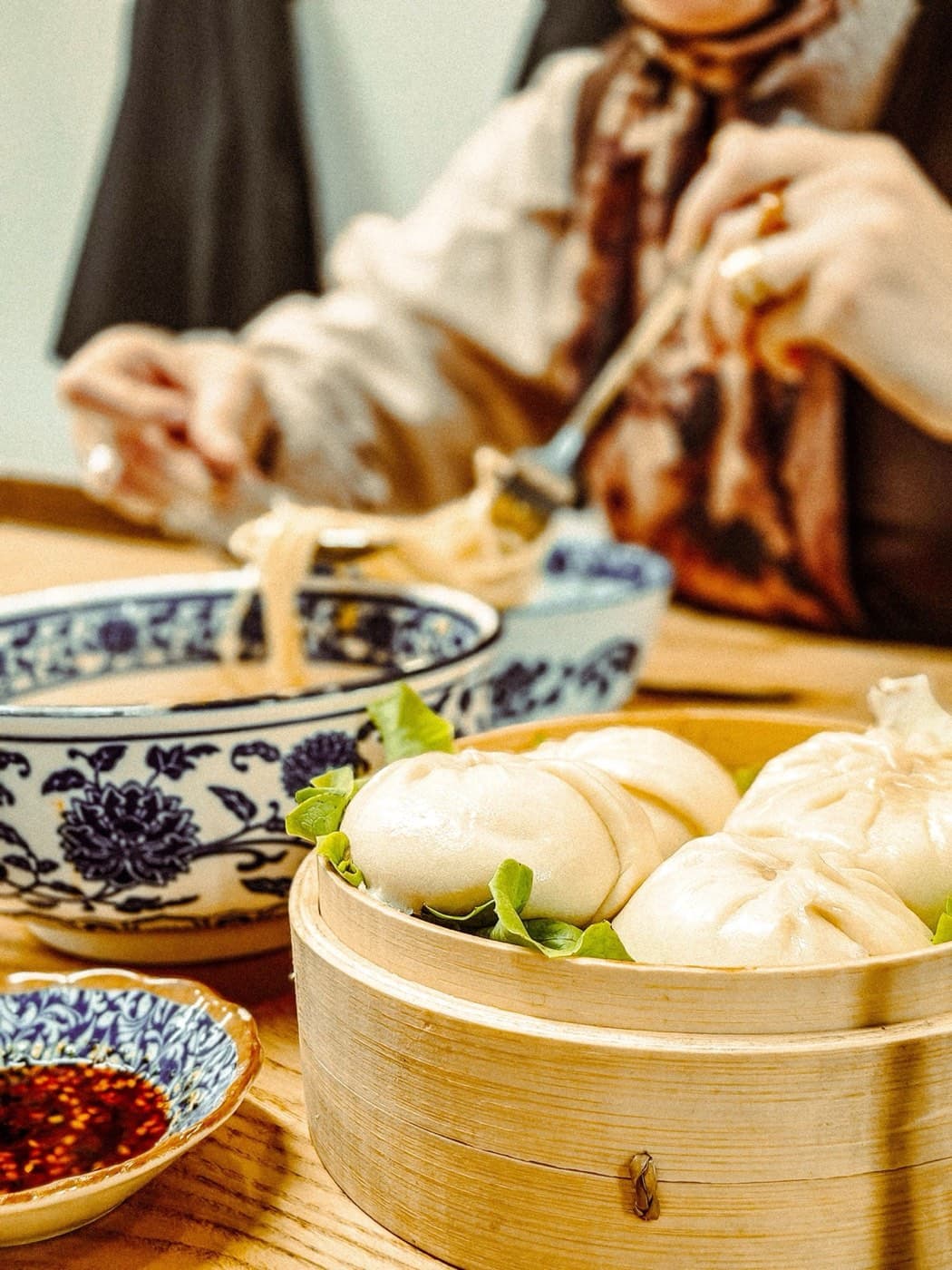 Steamed buns and a bowl of noodles — familiar Chinese home cooking