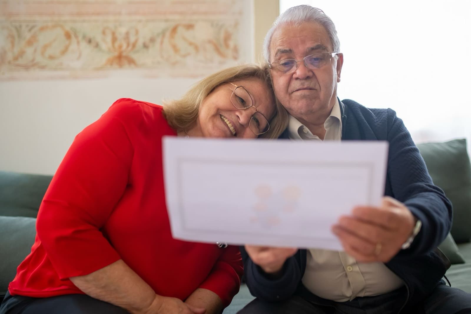A couple reviewing documents together at home